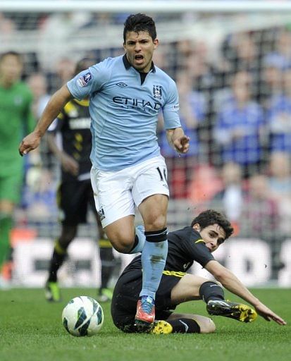 Manchester City striker Sergio Aguero skips past a challenge from Chelsea's Oscar on April 14, 2013